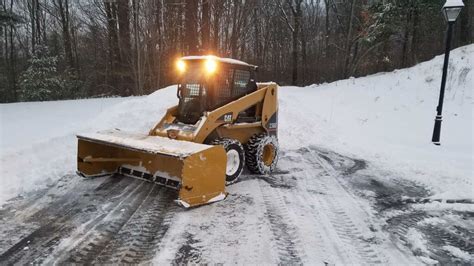 pushing snow with tracked skid steer|skid steer snow plowing.